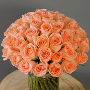 Peach rose in glass vase