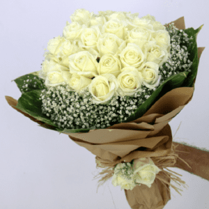 A bouquet of white roses,baby's breath and greenery hand-tied in a kraft brown paper.