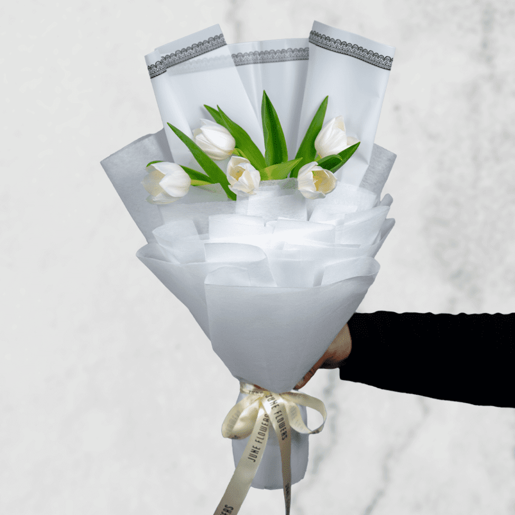 Stunning white tulip bouquet in a pristine Cellophane white wrapper