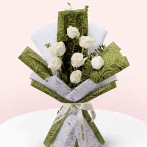 7 white roses and eucalyptus wrapped in soft non-woven floral paper