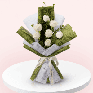 7 white roses and eucalyptus wrapped in soft non-woven floral paper
