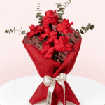 A Beautiful bouquet of 6 red rose tied up with white ribbon