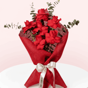 A Beautiful bouquet of 6 red rose tied up with white ribbon