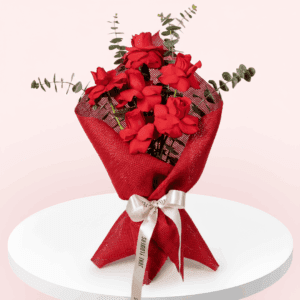 A Beautiful bouquet of 6 red rose tied up with white ribbon