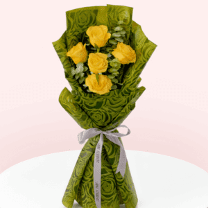 A bouquet of 5 Yellow roses and eucalyptus wrapped in green paper