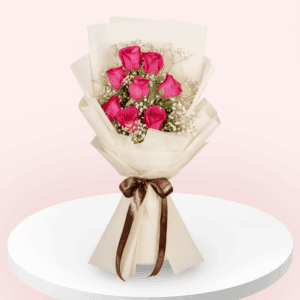 Bouquet of 8 Dark Pink roses and gypso in non-woven pastel cream colour paper wrap with ribbon