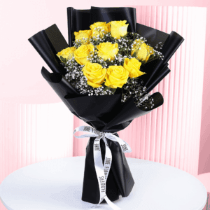 An Elegant black and yellow rose bouquet handtied with ribbon.