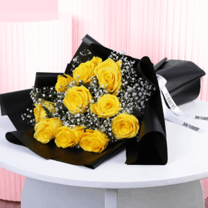 An Elegant black and yellow rose bouquet handtied with ribbon.