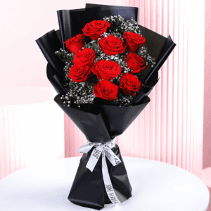 A bouquet of red roses wrapped in a black korean style sheet for a dazzling surprise.