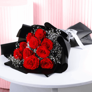 A bouquet of red roses wrapped in a black korean style sheet for a dazzling surprise.