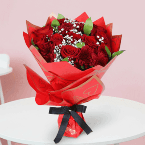 Red roses with baby’s breath and green fillers in a korean-style red gold heart wrap, finished with a “Love You” topper.