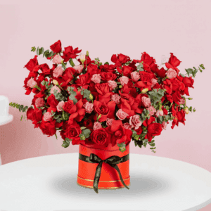 Valentine’s Day flower box with red roses, eustoma and eucalyptus arranged in a premium red round box.
