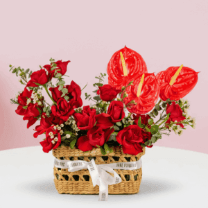 Premium Valentine red rose basket arrangement with anthurium and wax flowers.
