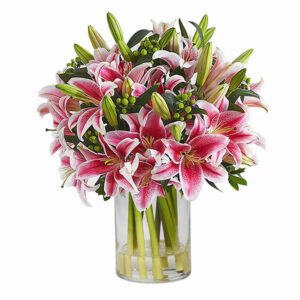 A vase filled with vibrant pink lilies surrounded by lush green leaves.